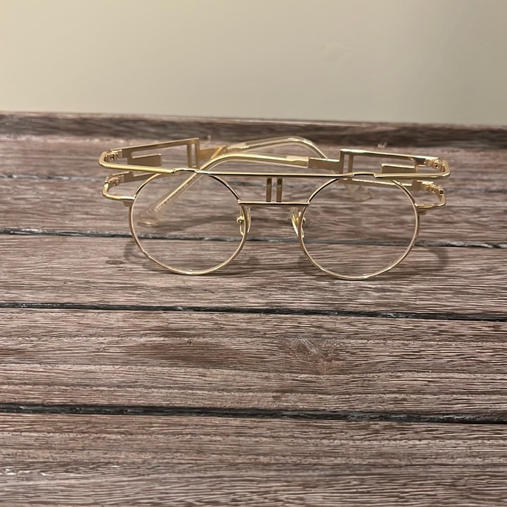Clear lens gold frame glasses